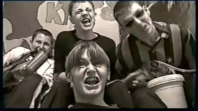 Sepia 1998 home video: three teenage friends miming a rock band