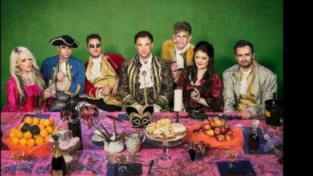 Stubblemelt band in baroque costume at a banquet table